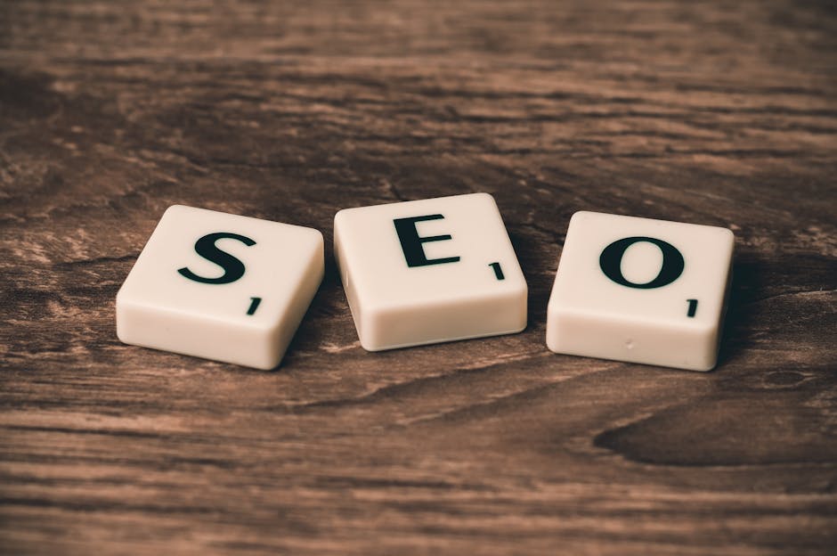 Scrabble tiles spelling ‘SEO’ on a wooden surface. Ideal for digital marketing themes.
