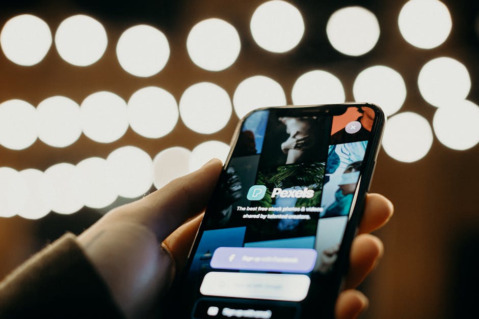 Close-up of a smartphone displaying an app interface with a blurred bokeh background for a modern tech feel.