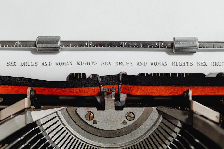 Close-up of a vintage typewriter with typed words advocating women’s rights.