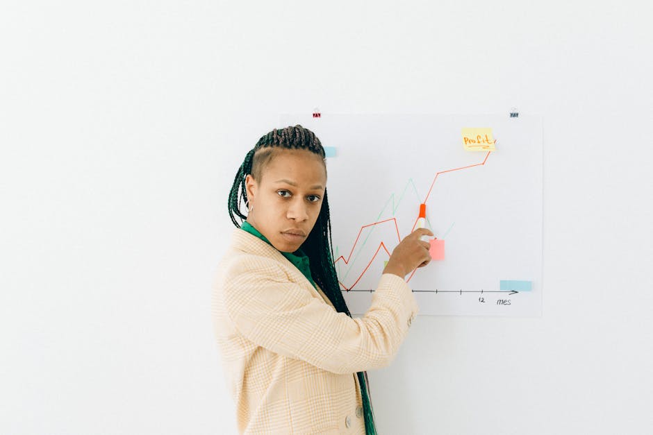 Confident woman explains financial data and growth strategy in a presentation.