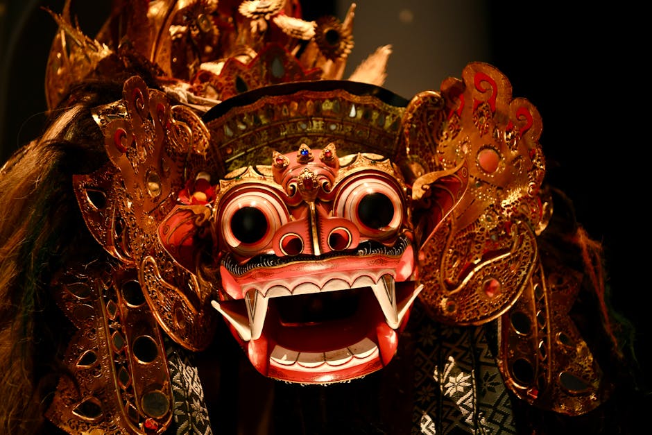 Close-up of a detailed Balinese Barong mask showcasing traditional craftsmanship and vibrant colors.