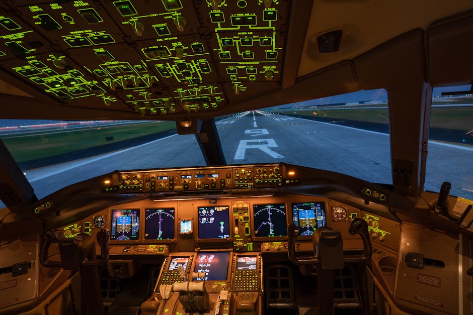 Night view of illuminated airplane cockpit with runway visible, showcasing advanced avionics.