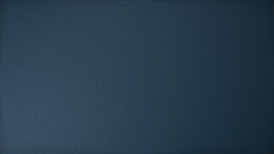 Dark blue textured background perfect for design projects and wallpapers.