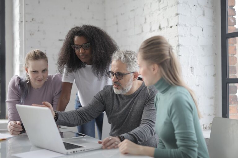 Team reviewing a WooCommerce catalog governance workflow before marketplace import
