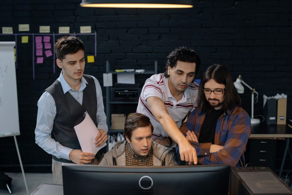 Team reviewing a WooCommerce catalog governance workflow before marketplace import