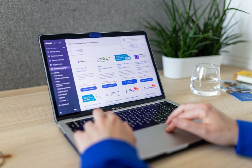Business team planning WordPress or Shopify business website project on a laptop