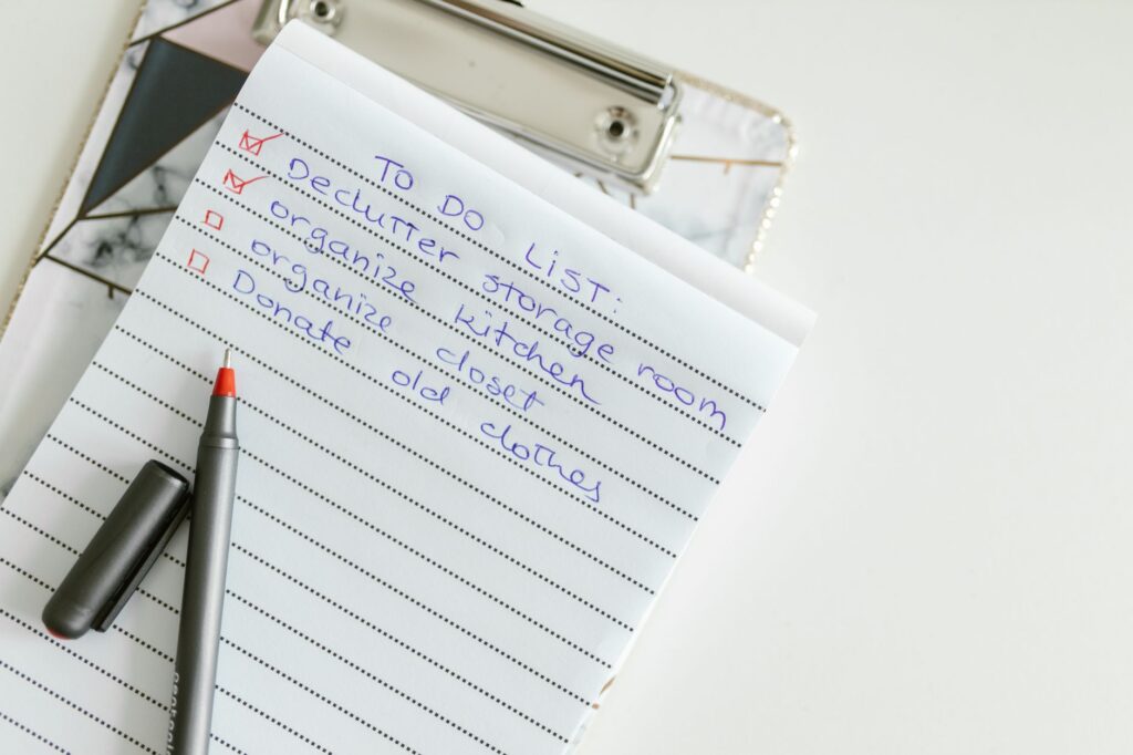 Discovery interview notes on a paper notepad with bullet points circled by hand